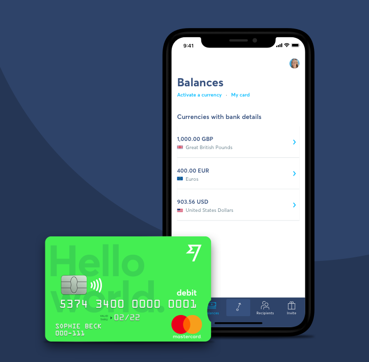 Wise mobile app pictured on a smartphone with a green Wise debit card just in front.